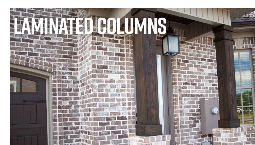 Laminated wood columns supporting a brick porch