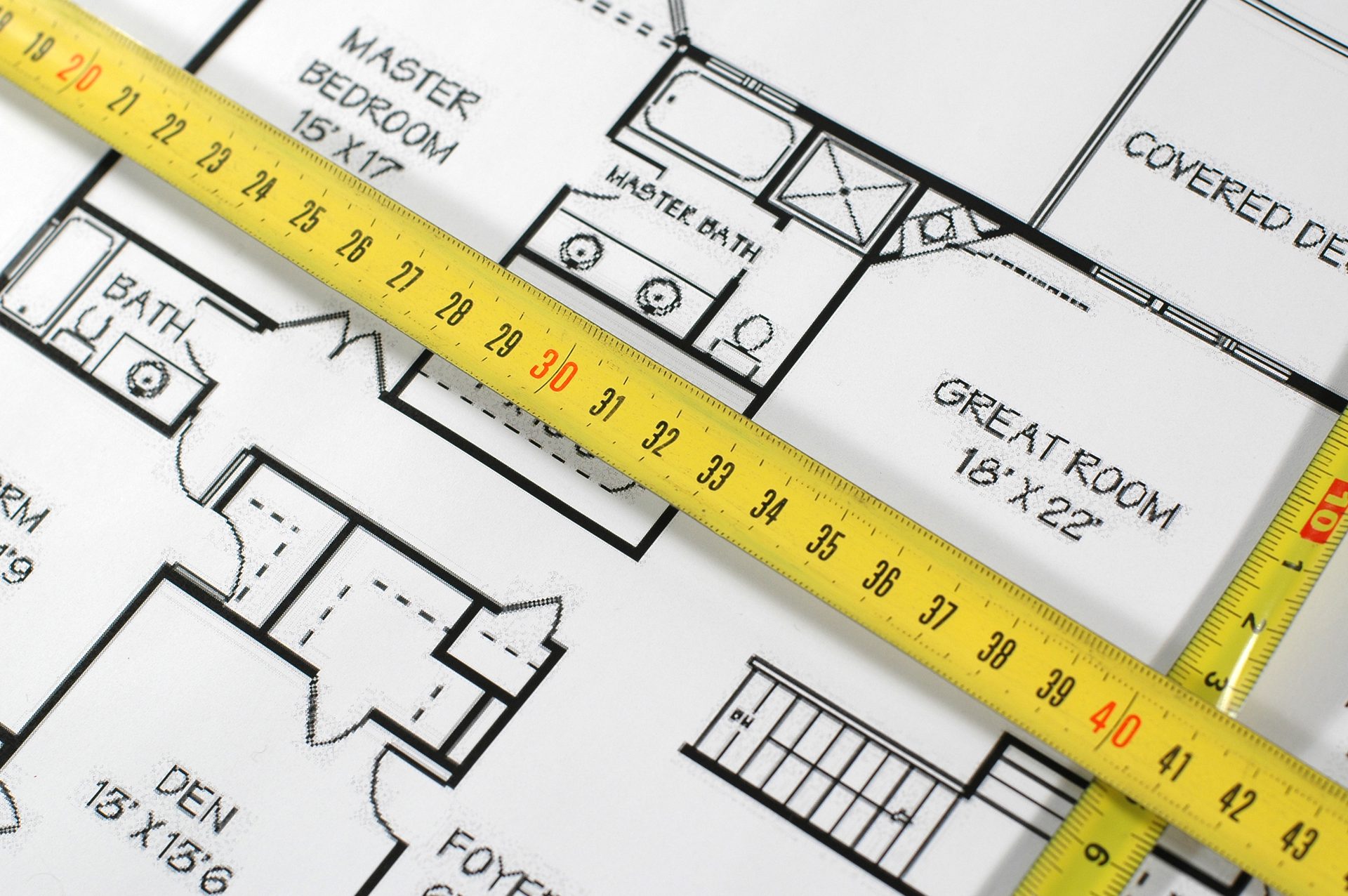 House plans with a tape measure on top, Midway Supply estimating and takeoffs